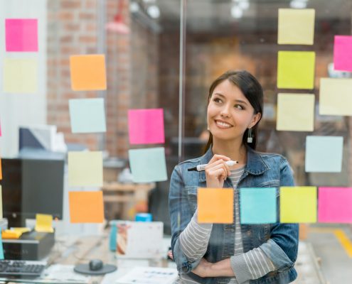 Woman thinking of ideas at the office